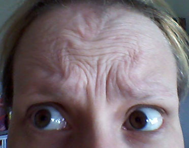Omega sign on forehead before Bocouture